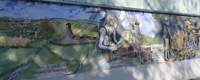 Eckardts neuestes Wandgemälde zeigt Szenen aus der Zeit des Wismutbergbaus und befindet sich an einer Mauer des Schachts 15IIb in Bad Schlema.