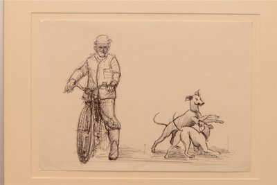Radfahrer mit Hunden.