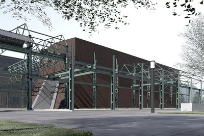 An der neuentstehenden Halle wird außen das markante Stahlgerüst der alten Werkshalle 18 installiert.