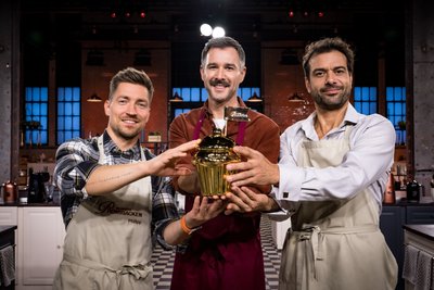 Kai Schumann (r.) neben TV-Moderator Jochen Schropp (Mitte) und Kunstturner Philipp Boy (l.).